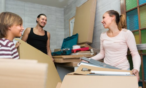 Flat removals planning in Silvertown with moving boxes and apartment access