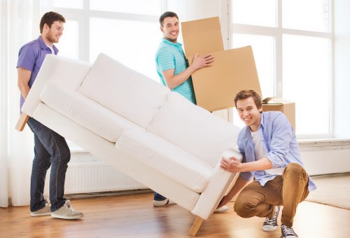 Professional movers handling furniture during a Silvertown home relocation